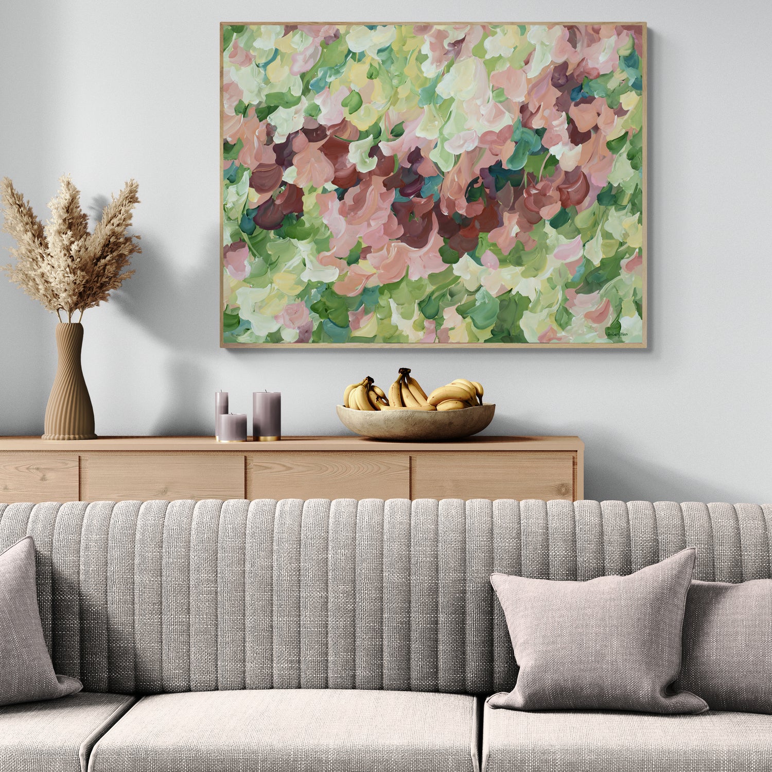 Modern nature art print in contemporary colours of warm brown and pinks and natures green. Contemporary impressionist simple style. Framed in a natural frame and hanging against a living room wall.