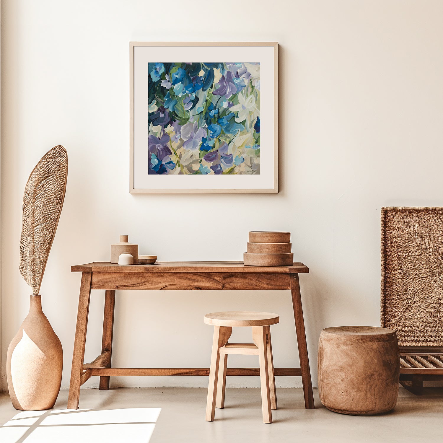 Modern blue and purple abstract floral art print hanging in a modern neutral living room.