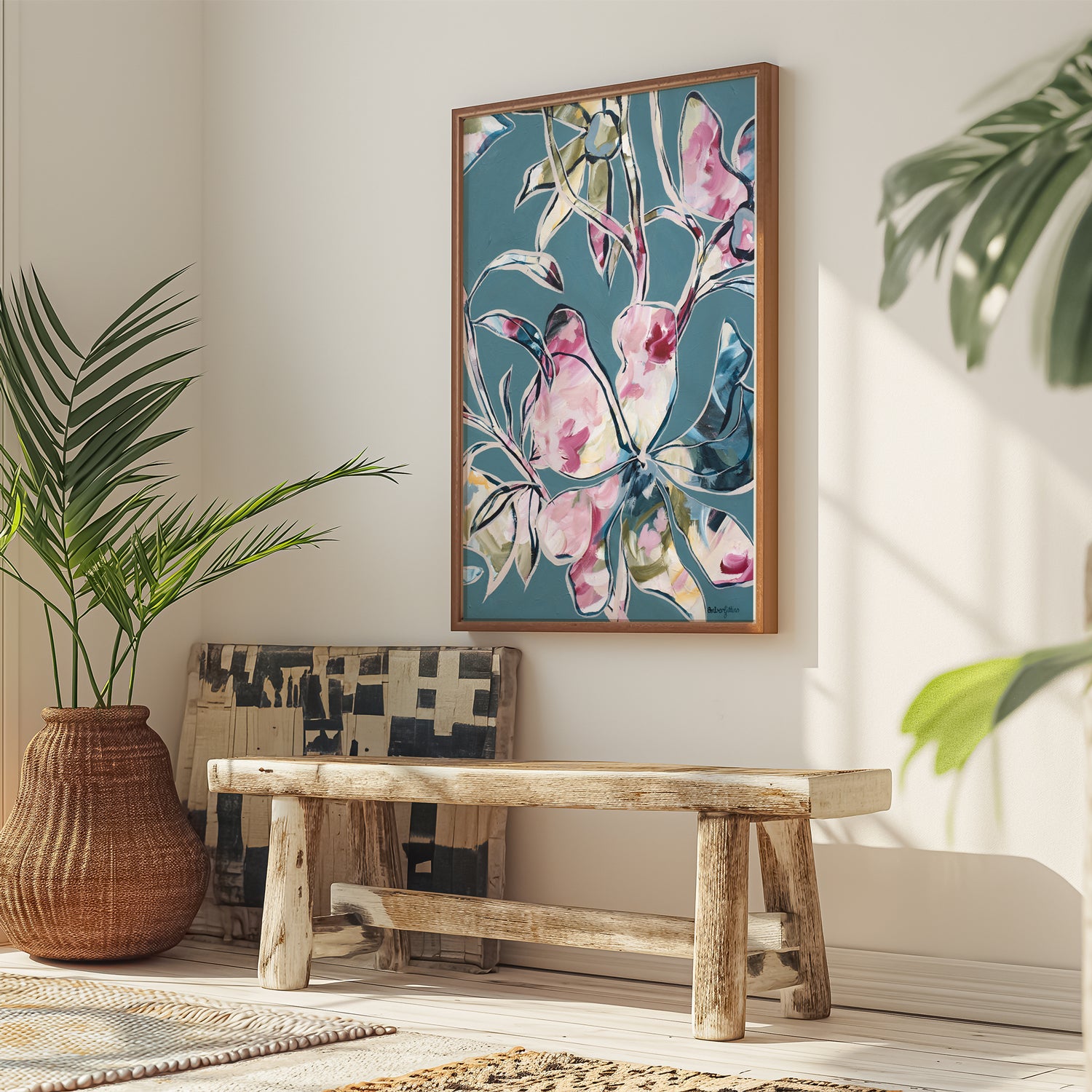 Modern blue and pink abstract flower art print with a natural frame hanging in a modern living room.