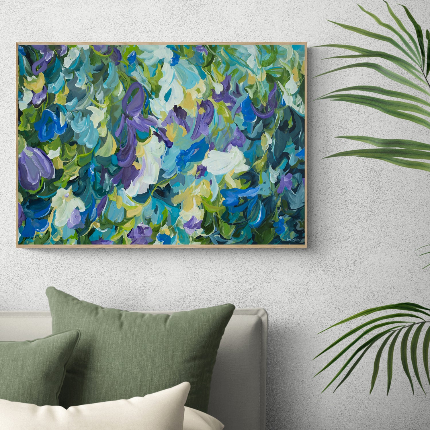 Modern blue and purple abstract impressionist style flower painting in a natural frame. Hanging on a bedroom wall.