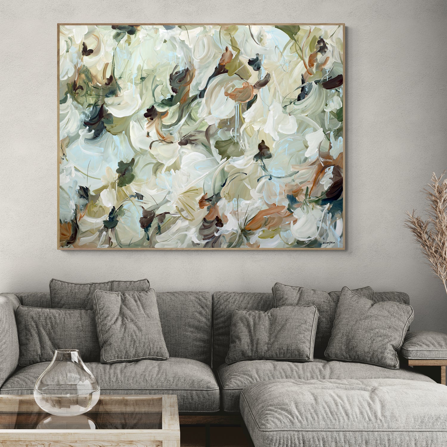 Large neutral coloured of browns and greens, wildflower statement original painting in a living room interior setting.