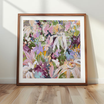 Framed colourful floral art print on a wall with wooden floor