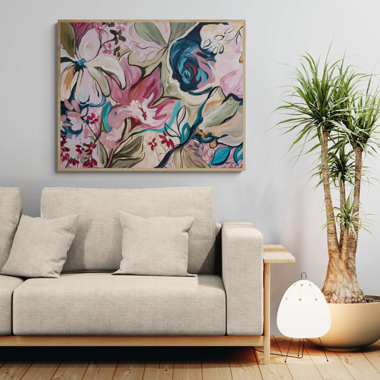 Living room with a floral abstract canvas art print, beige sofa, and potted plant.