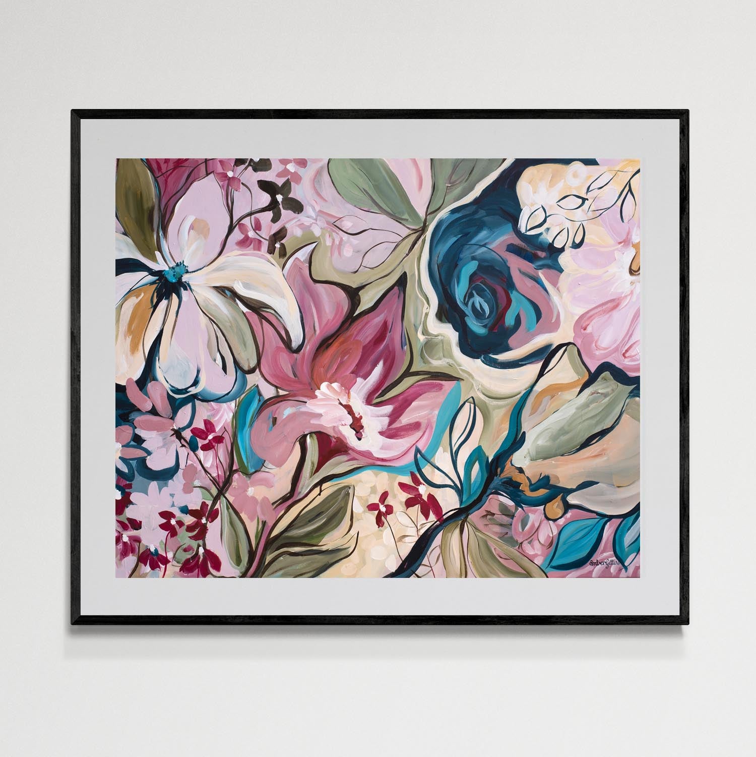 Framed floral artwork with colorful flowers on a white wall