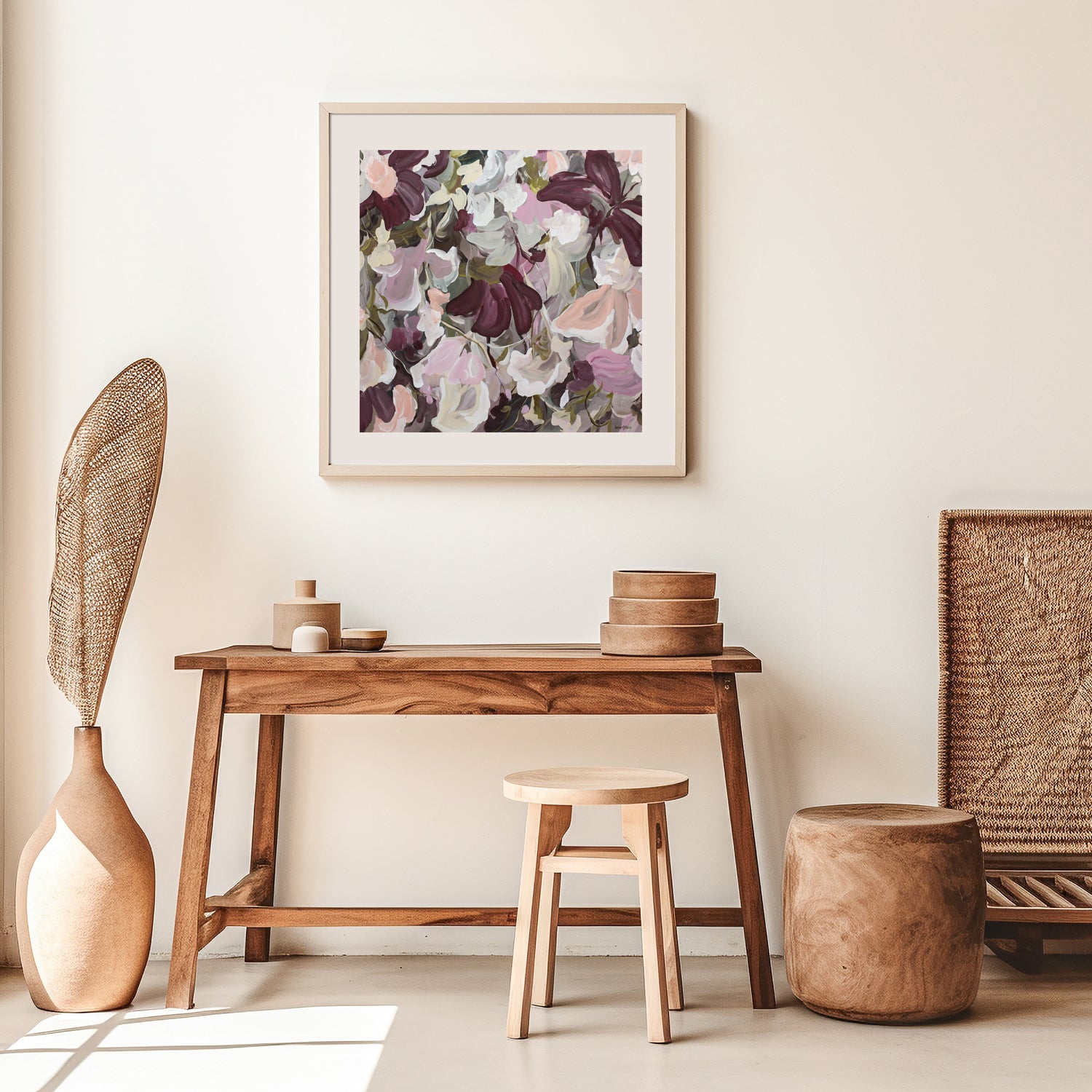 Abstract floral art print in warm earth browns and pinks. Hanging in a study nook with a desk.