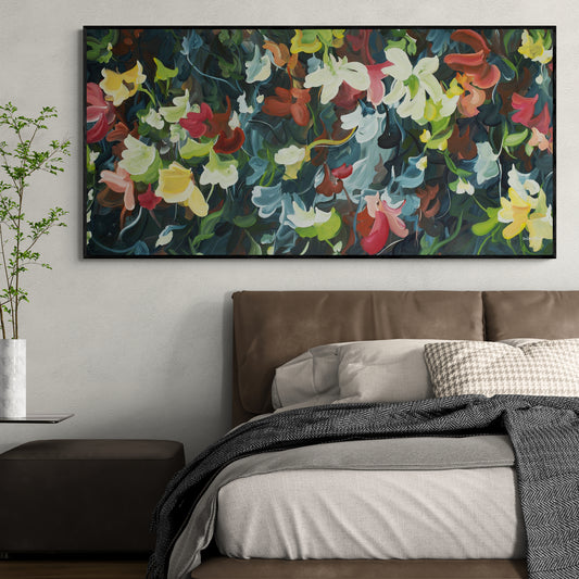 Large black and red modern abstract flower painting hanging in a bedroom