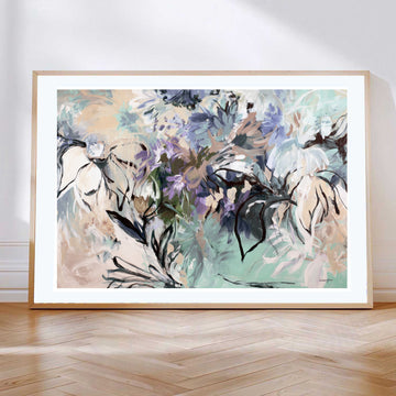 Contemporary abstract fine art print of a flower garden. Expressive style with linear flower shapes and simple solid flower petals in layers. Modern colours of spearmint, purple, beige and browns. Framed in a natural frame that is leaning against a lounge room wall.