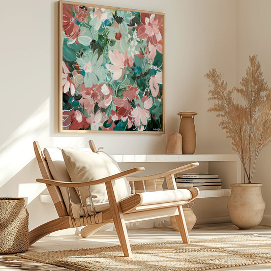 Modern living room with a wooden chair, abstract green and pink floral canvas print and decorative elements.