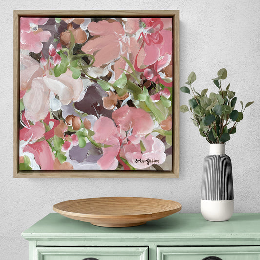 small contemporary pink  and green abstract flower painting with a natural frame hanging on a wall.
