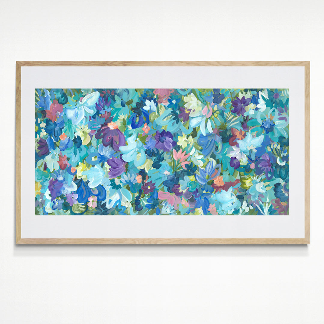 Colourful blue and purple abstract flower fine art print. Layers of flower petals and leaves in a modern impressionist style. Framed in a natural frame.