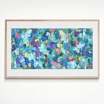 Colourful blue and purple abstract flower fine art print. Layers of flower petals and leaves in a modern impressionist style. Framed in a natural frame.