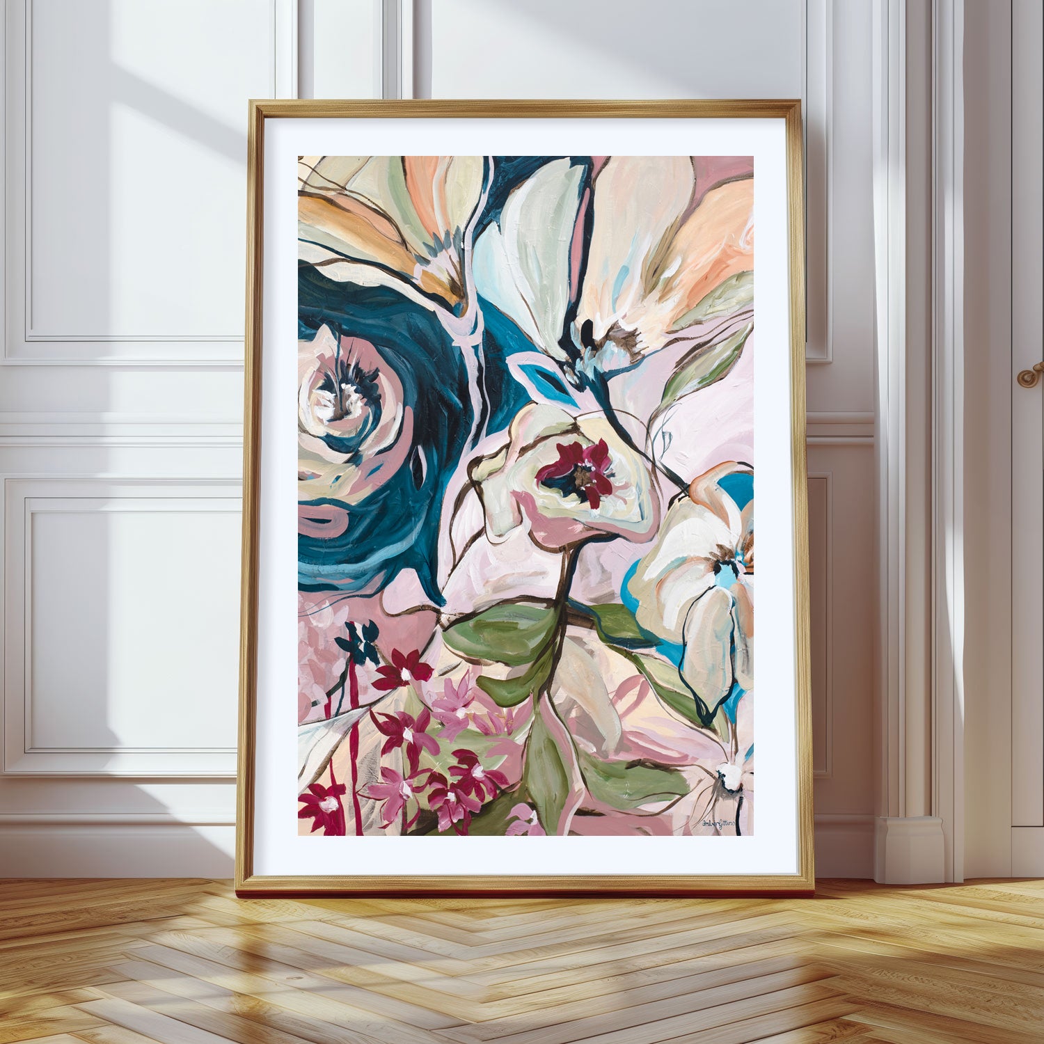 Abstract floral art print with a natural frame leaning against a wall.