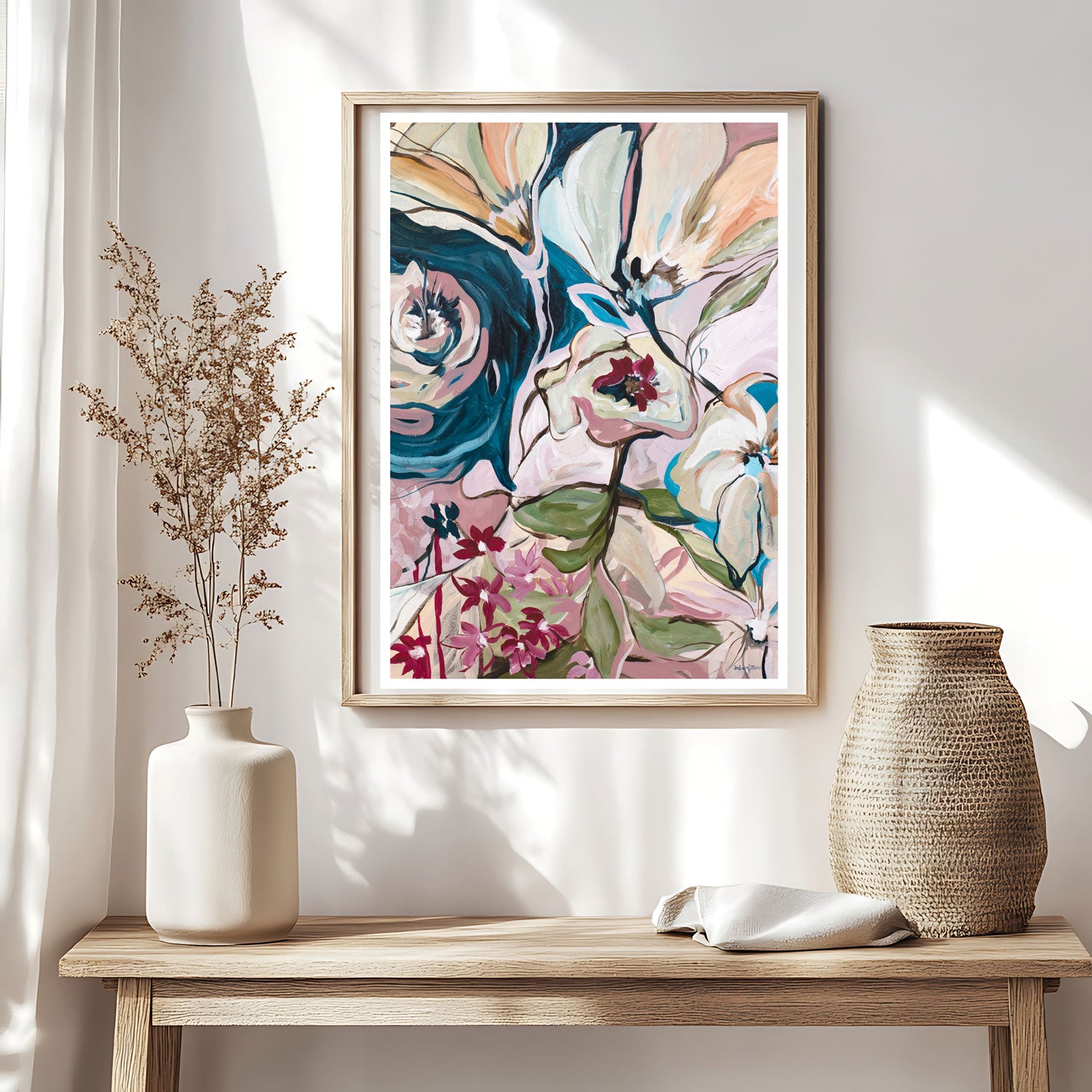 Abstract floral art print hanging in a modern neutral living room