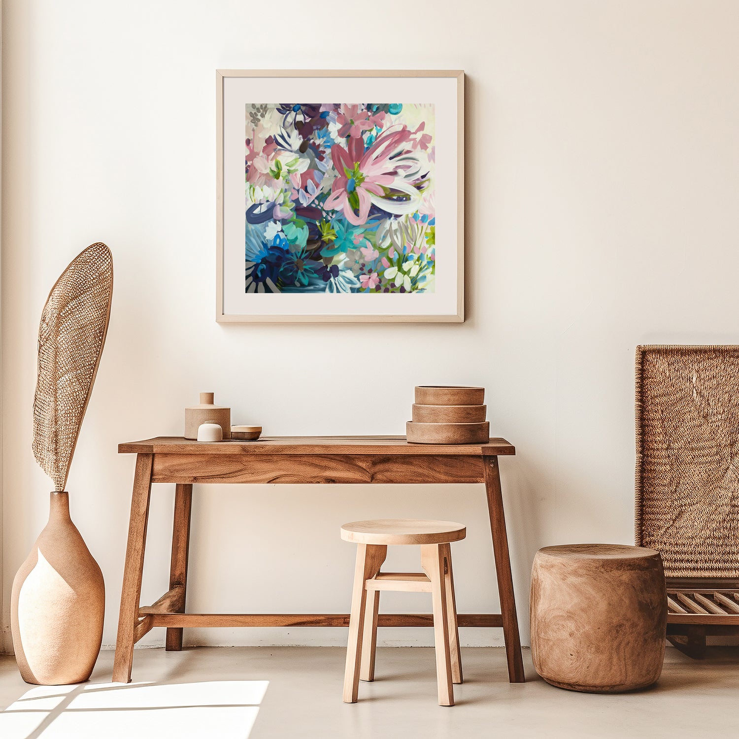 Colourful abstract flower botanical fine art print. Hanging over a desk and chair in a natural modern living space.