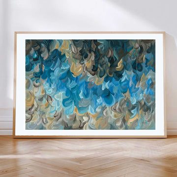 Modern coastal and water inspired abstract art print in blues and ochre yellow. Layers of soft organic shapes in a contemporary impressionist style. Framed in a natural frame.