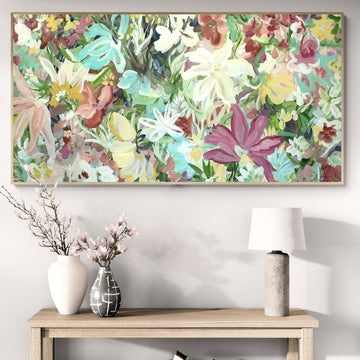 Colourful wildflower abstract art with a natural frame, hanging in a living room.