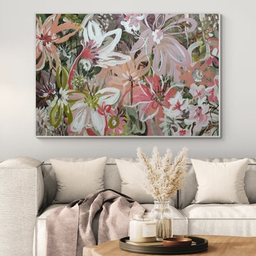 Large pastel pink and green abstract flower painting hanging in a neutral lounge room.