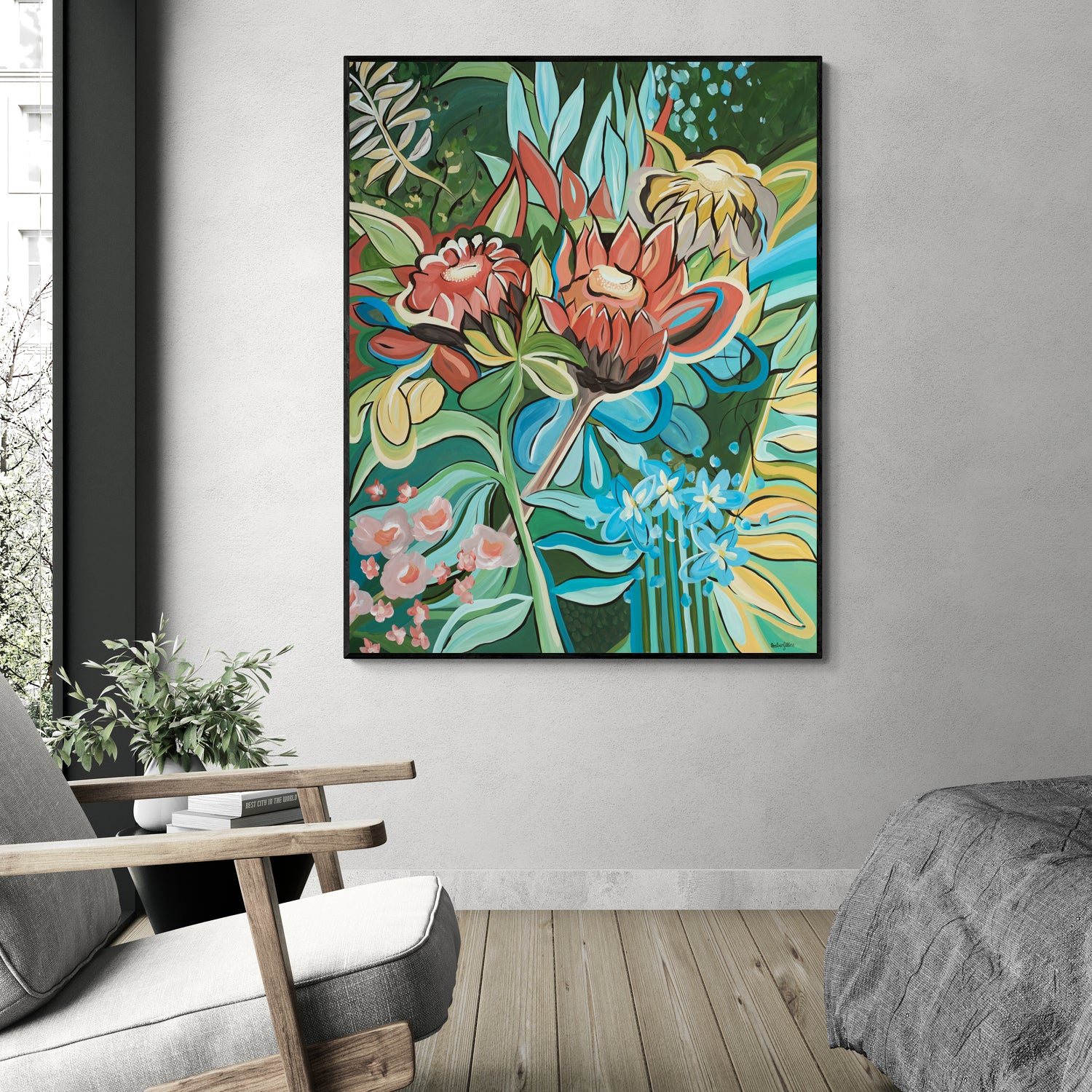Colorful floral Protea painting on a wall in a living room setting