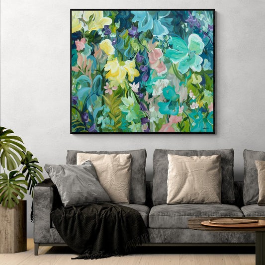 Colourful painting of a lush flower landscape hanging in a modern living room