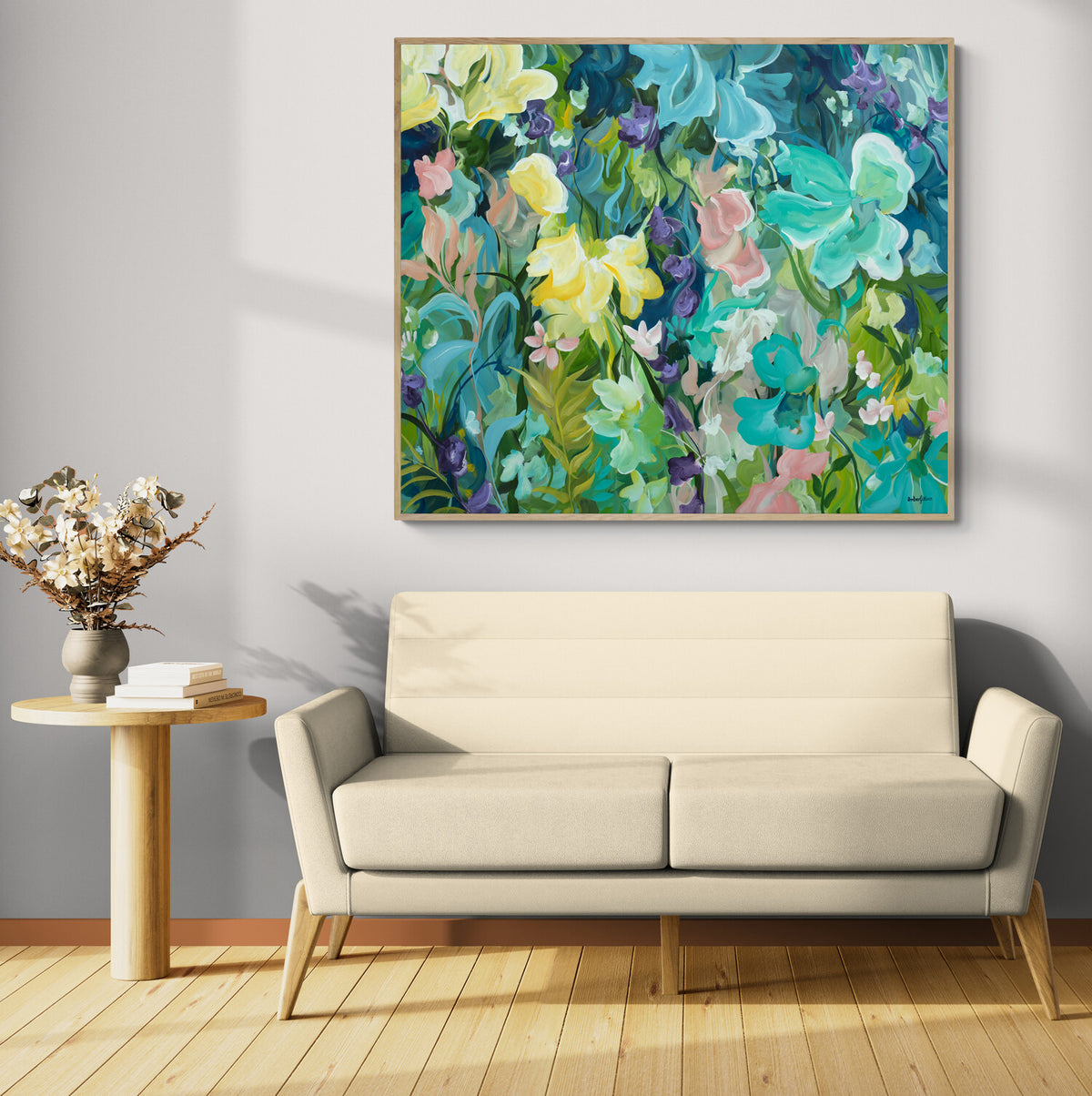 Colourful painting of a lush flower landscape hanging in a modern living room