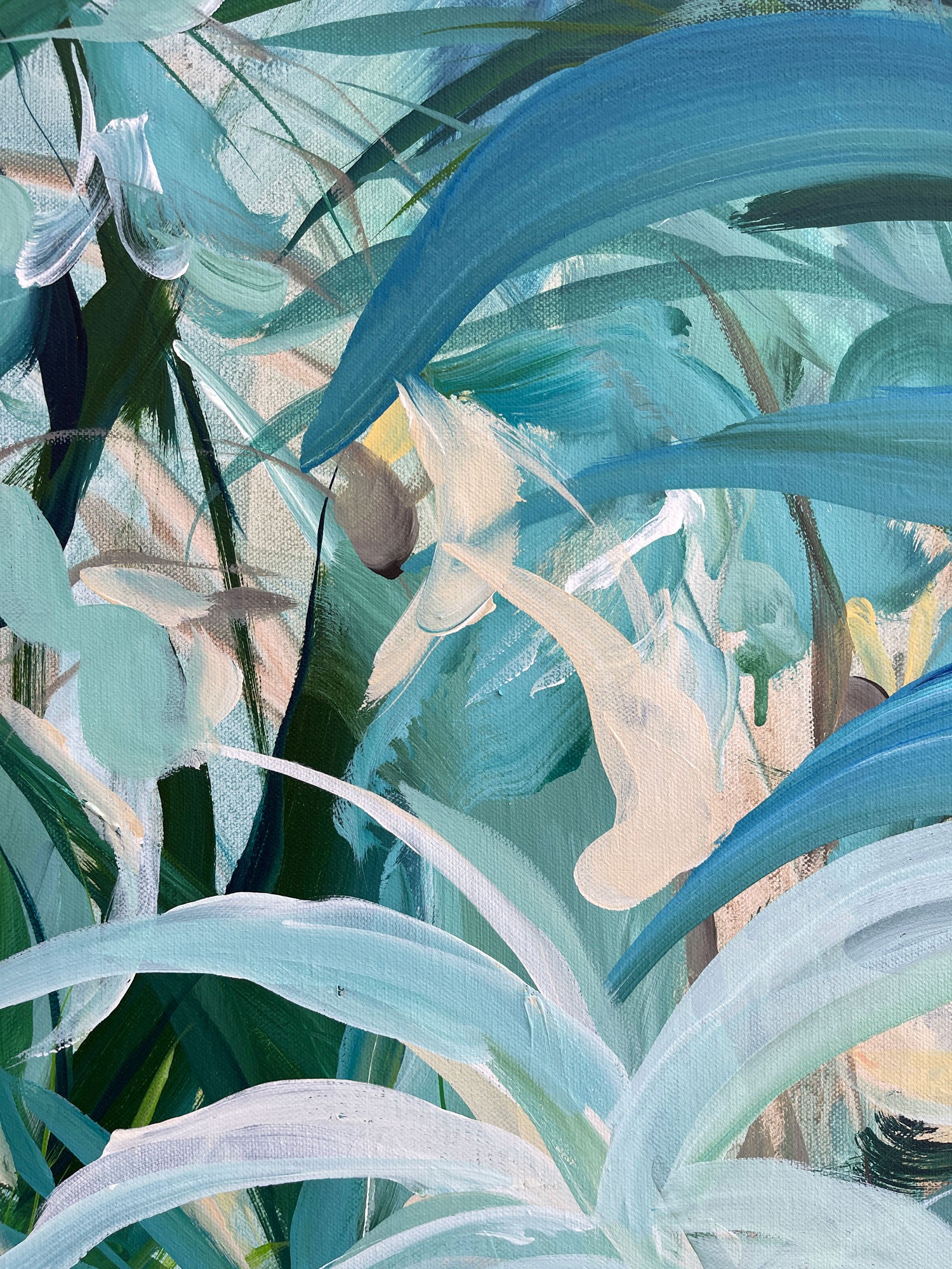 Close-up of tropical leaves with a focus on blue and green hues